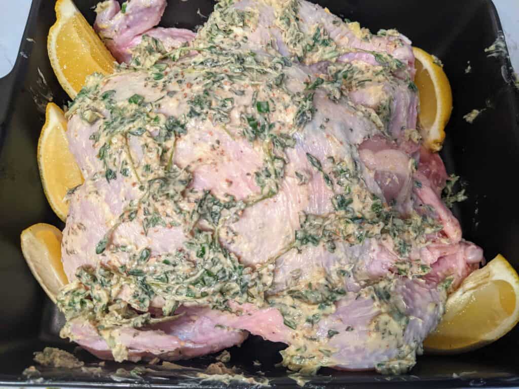 raw whole chicken with butter