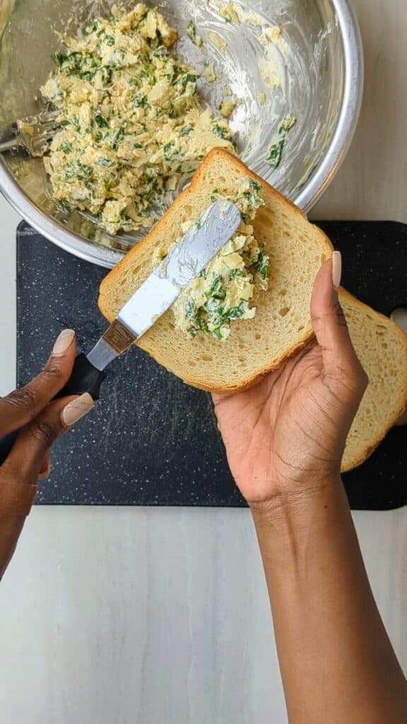 spinach and artichoke grilled cheese spread on bread