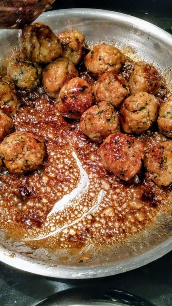 glazed chicken meatballs in a pan